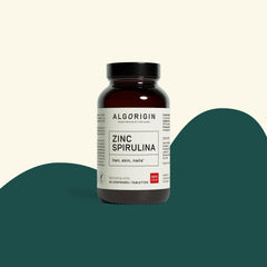 Flacon de spiruline zinc Algorigin en verre brun, 60 comprimés, étiquette Zinc Spirulina, sur fond crème et vert foncé